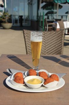 Beer and warm fried snacks, dutch bitterballen