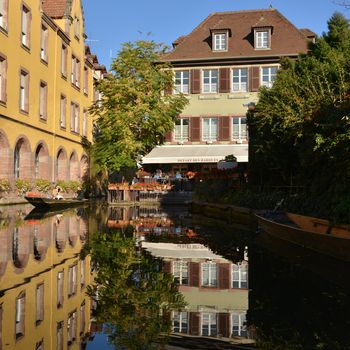 Colorful traditional french houses on the side of river Lauch in Petite Venise, Colmar, France