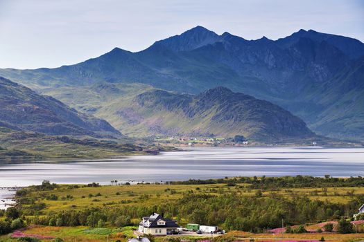 Norway villages in fjord on lofoten islands. Cloudy Nordic day.