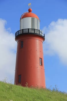 A small vintage lighthouse at the North Sea Coast