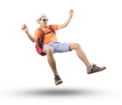 portrait of young asian traveler man floating mid air with crazy acting isolated white background use for people emotion ,active and happy holiday vacation 