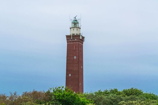 Quadrangular Lighthouse in the sand dunes at Vuurtoren Westhoofd near the city Outdorp in Zuid-Holland.