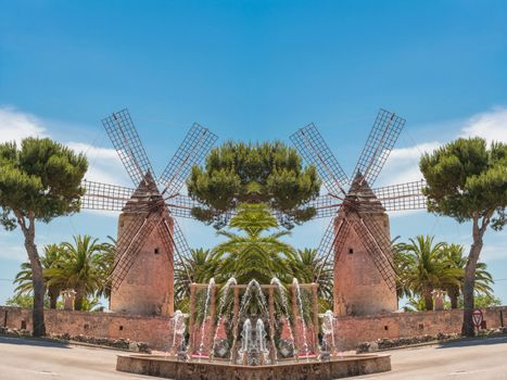 Photomontage, two old historic windmill at a country estate in Mallorca (Spain)