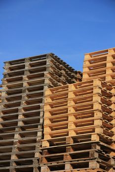 Stacked wooden pallets at a pallet storage