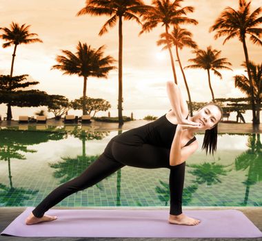 asian woman health care yoga posting beside swimming pool