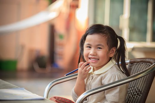 toothy smiling face of adorable sian children at home happiness emotion