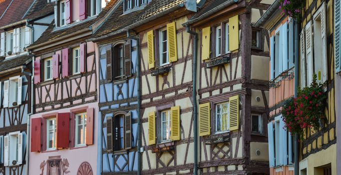 Colorful traditional french houses on the side of river Lauch in Petite Venise, Colmar, France