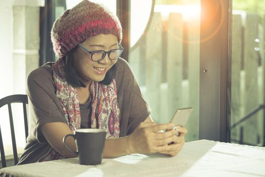 asian woman relaxing emotion happiness face looking to smart phone and reading text on screen 