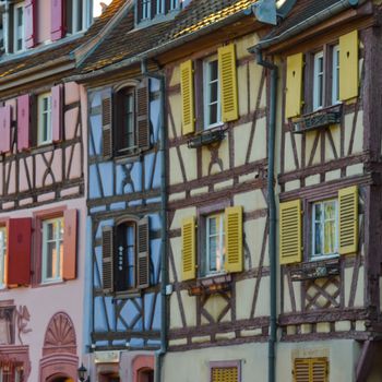 Colorful traditional french houses on the side of river Lauch in Petite Venise, Colmar, France