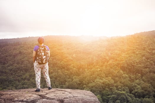 traveling woman relaxing trekking on rock cliff use for people leisure lifestyle