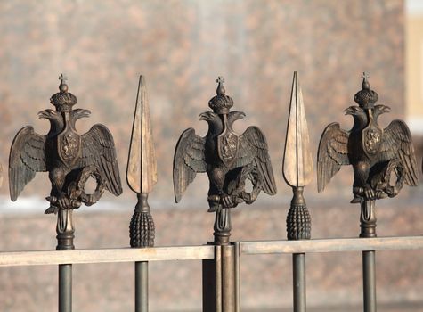 fence decorations with Russian  Double Headed Eagle close to