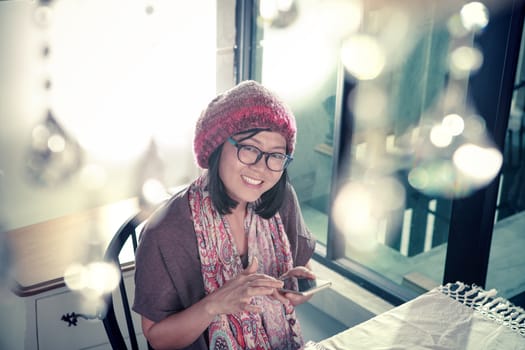 happiness toothy smiling face of asian young woman and smart phone chat in hand use for people modern digital lifestyle