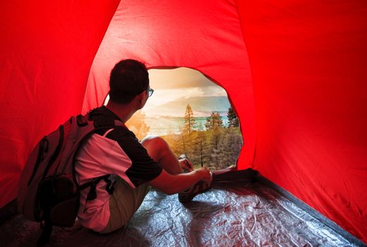 camping man in camper tent looking to beautiful natural scenic use for people vacation traveling to destination