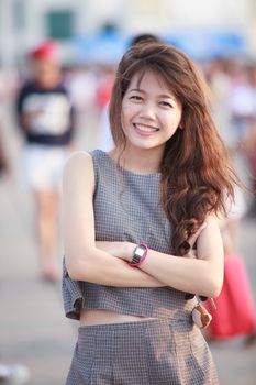 portrait of young beautiful asian woman standing and toothy smiling to camera with happiness emotion