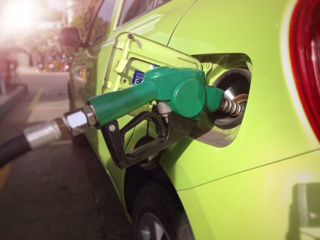 Fill the machine with fuel or car refueling at petrol station (Selective focus)