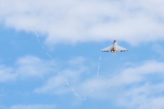 Fighter Jet flying away from camera