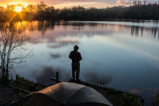 Sunrise with a Carp Angler overlooking Lake