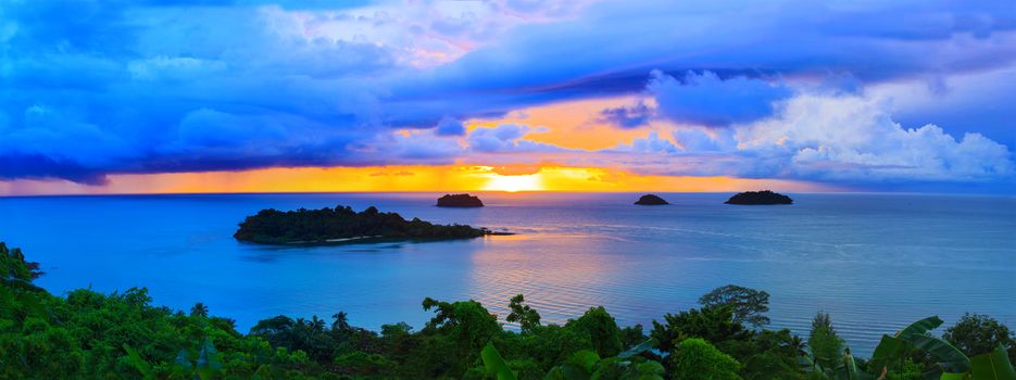 panorama scene of raining clouds and sun set sky behind koh chang island in trat province eastern sea of thailand 