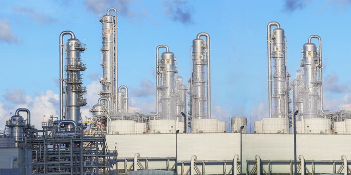 exterior of oil refinery chimney tube building  in heavy petroleum and  petrochemical industry estate use for fussil fuel,energy and gas power industrial