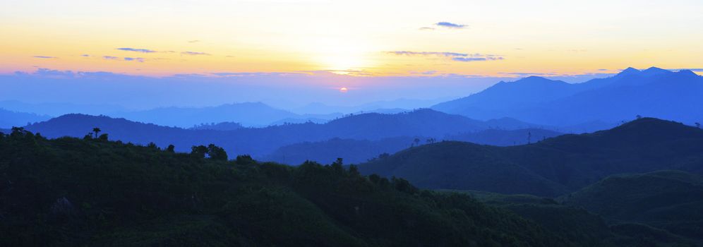 panorama view of sun rising over mountain scene use for natural background,backdrop