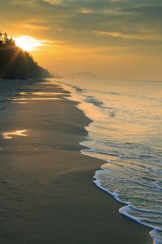 natural land scape of sun rising on sea beach vertical form