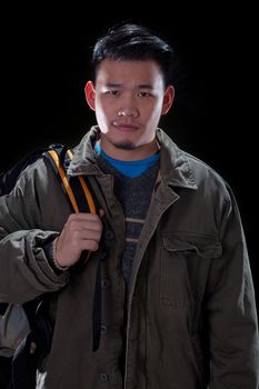 young asian man carrying back pack use for people traveling and vacation holiday activities