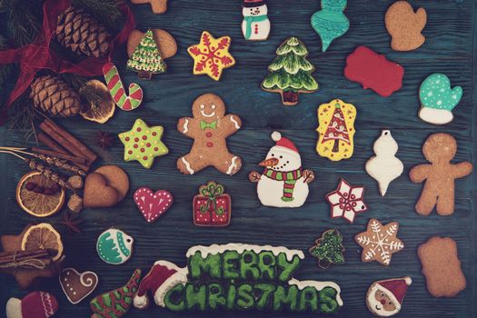 Gingerbreads for new years and christmas on wooden background, xmas theme