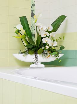 Beautiful white orchid flower decor in bathroom design