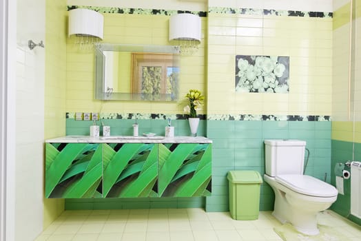 Modern bathroom design in green colors with orchid print