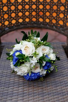 Stylish wedding bouquet close up lying on a chair