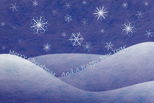 Winter scene with snowy mountains and snowflakes and the words Merry Christmas And A Happy New Year, christmas card