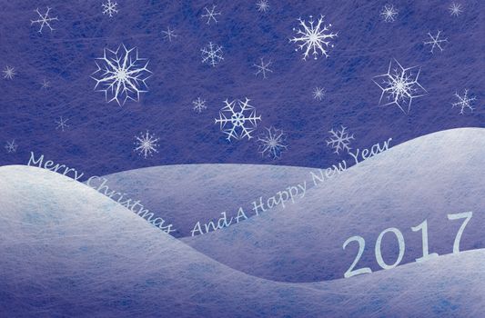 Winter scene with snowy mountains and snowflakes and the words Merry Christmas And A Happy New Year, christmas card
