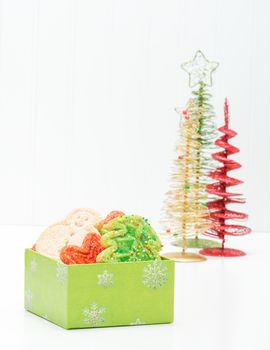 Gift box filled with a variety of festive christmas sugar cookies.