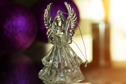 Crystal Angel on the background of Christmas balls. new Year decoration. Christmas ornaments, christmas decoration