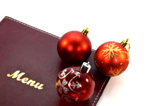 Menu card with three christmas balls on a corner