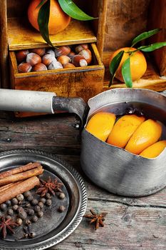 hot drink based on red wine,orange and spices in saucepan