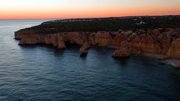 Aerial from famous beach Praia da Marinha in the Algarve Portugal at sunset