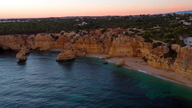 Aerial from famous beach Praia da Marinha in the Algarve Portugal at sunset