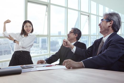 working woman show power in office meeting room in front of senior administrator 