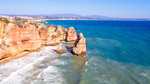 Aerial from rocks and ocean near Lagos in Portugal