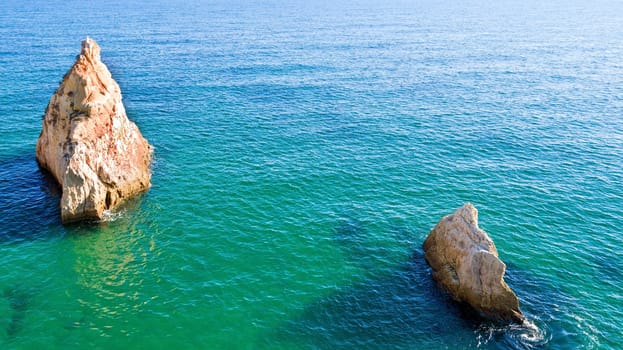 Aerial from natural rocks near Alvor in the atlantic ocean in Portugal