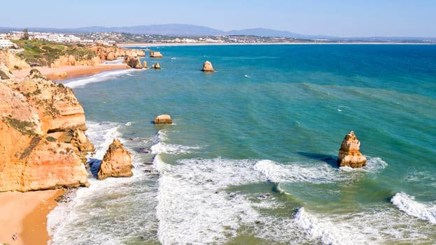 Aerial from rocks and ocean near Lagos in Portugal