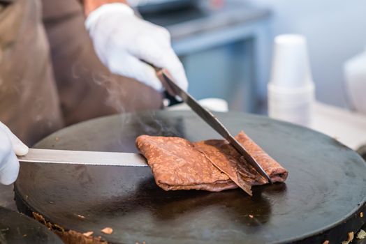 chocolate hot pancake fried on the stove