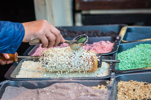 cake topped with white Sweet cereals during cooking