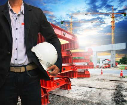 engineer man with safety helmet working in road and bridge construction site 