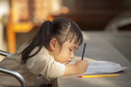 asian children doing home work