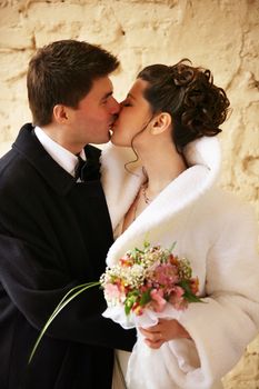 Beautiful the bride and the groom kiss