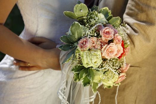 Newly married pair with bouquet