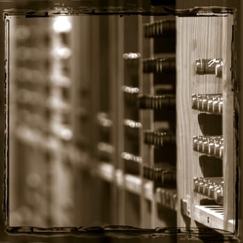Wine bottles on wooden shelf in wine store, France