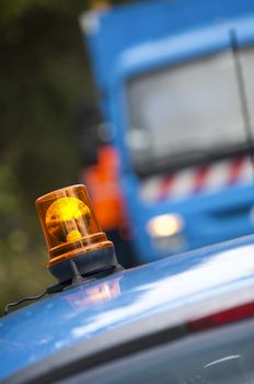 Orange flashing and revolving light on top of a support and services vehicle, France